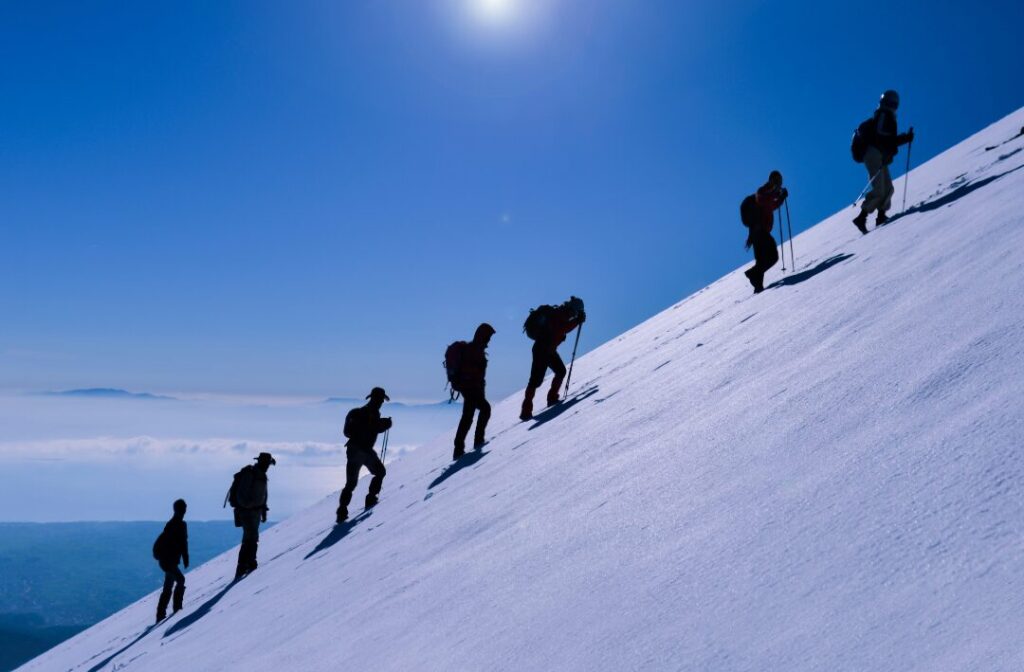 climbing a snow-covered mountain
